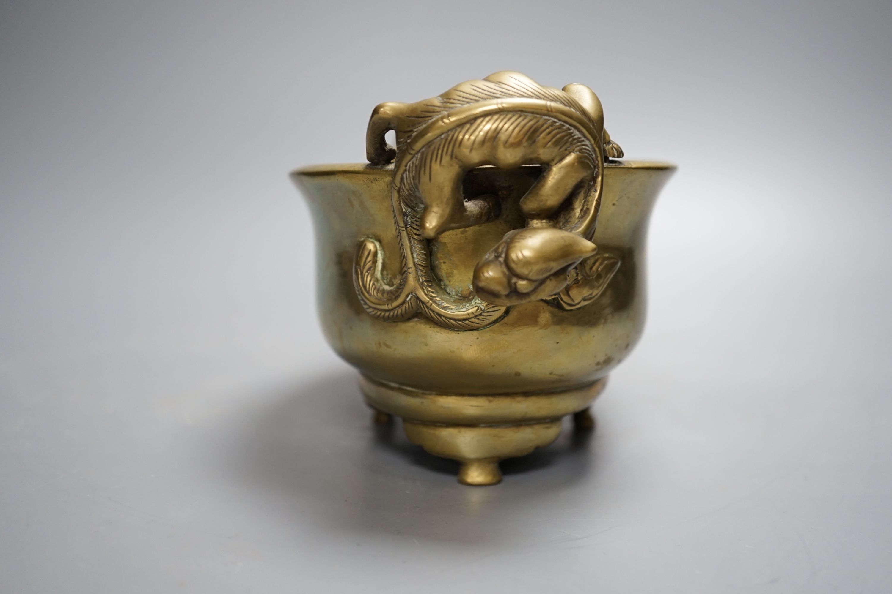 A 19th century Chinese bronze censer with ‘dragon’ handles, Xuande mark, 26cm